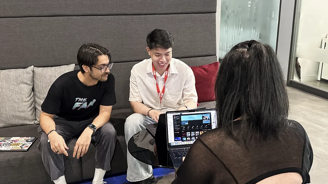 The Adfinity team collaborating over a campaign in the office